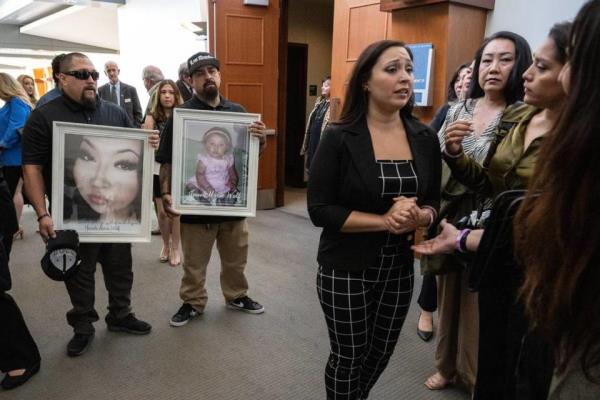 As Jacob Chavez and Johnny Tabular hold photographs of their niece Jewels Marie Wolf, the victim’s mother Regina Leah Chavez speaks with family and friends after the sentencing of Nathanial Evan Cabacungan, 22, at Placer Superior Court on Tuesday in Roseville, for second-degree murder for the fentanyl death of her daughter. Cabacungan, 22, was sentenced to 15 years to life in prison for what is believed to be the first murder conviction in California for a fentanyl death.